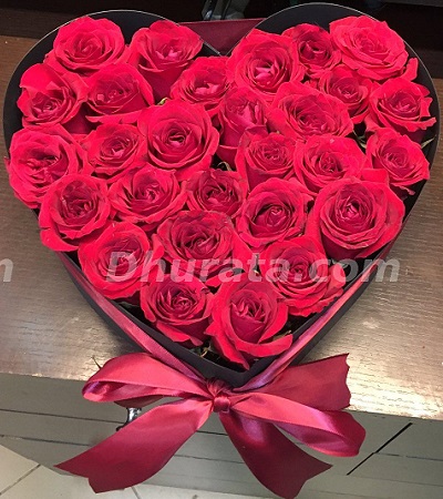 Red roses in heart shaped box